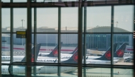 Air Canada airplanes stand on the tarmac at Pearson International Airport in Toronto on August 16, 2025. (Photo by Peter Power / AFP)