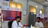A healthcare official attending to a patient at the field hospital in Bangladesh.