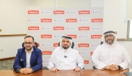 QRCS and talabat officials at an event.