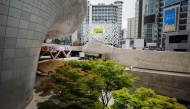 A general view shows the Dongdaemun Design Plaza (DDP) and surrounding buildings in Seoul on August 25, 2025. (Photo by ANTHONY WALLACE / AFP)