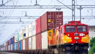 A freight train carrying cargo containers rides along a railway track in Ajmer on August 26, 2025. Photo by Himanshu Sharma / AFP