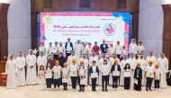 QOC officials with participants at the end of the summer program.