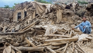 An Afghan man sits amid the remains of a damaged house, in the aftermath of an earthquake at the Dara-i-Nur district of Nangarhar province on September 3, 2025. Photo by AFP