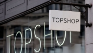 A sign is pictured outside a closed branch of the fashion retailer Topshop in central London on February 1, 2021. Photo by Tolga Akmen / AFP