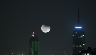 This double-exposure photo shows a view of lunar eclipse in the sky over Nairobi, Kenya, on September 7, 2025 . (Xinhua/Yang Guang)
