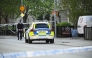 Police officers cordon off the scene after several people were killed in a shooting at Vaksala Square in central Uppsala, Sweden on April 29, 2025. (Photo by Fredrik SANDBERG / various sources / AFP)

