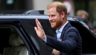 Britain's Prince Harry, Duke of Sussex waves as he departs the Centre for Blast Injury Studies, at the Imperial College in London, on September 10, 2025. (Photo by Suzanne Plunkett / POOL / AFP)
