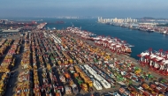 Containers and ships are seen at the container terminal of the port in Qingdao, in China's eastern Shandong province on September 10, 2025. (Photo by AFP)
 