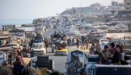 Palestinians transport their belongings as they evacuate Gaza City towards southern areas of the coastal Gaza Strip, on September 10, 2025. (Photo by Eyad Baba / AFP)