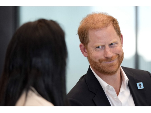 Britain's Prince Harry, Duke of Sussex, reacts as he takes part in a panel discussion on how social action positively impacts mental health, with four young people who are involved with The Diana Award, in central London on September 11, 2025. (Photo by Aaron Chown / POOL / AFP)