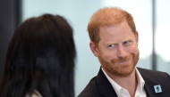 Britain's Prince Harry, Duke of Sussex, reacts as he takes part in a panel discussion on how social action positively impacts mental health, with four young people who are involved with The Diana Award, in central London on September 11, 2025. (Photo by Aaron Chown / POOL / AFP)