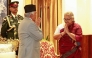 Nepal's President Ram Chandra Paudel gestures after administering the oath to the country's newly appointed Prime Minister Sushila Karki during her swearing-in-ceremony at the President House in Kathmandu on September 12, 2025. (Photo by Sujan Gurung / AFP)
 