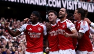Arsenal's Spanish defender #36 Martin Zubimendi (2L) celebrates scoring the team's first goal with Arsenal's English defender #20 Noni Madueke (L) during the English Premier League football match between Arsenal and Nottingham Forest at the Emirates Stadium in London on September 13, 2025. (Photo by HENRY NICHOLLS / AFP)