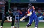 India's captain Suryakumar Yadav plays a shot during the Asia Cup 2025 Twenty20 international cricket match between India and Pakistan at the Dubai International Stadium in Dubai on September 14, 2025. (Photo by Fadel SENNA / AFP)
