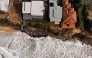 (Files) An aerial file photo taken on July 28, 2020 shows homes perched on Australia's eastern coastal town of Wamberal. (Photo by Peter Parks / AFP)