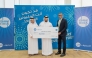 Fatima Mohamed Al-Ansari’s brother receiving the grand prize from QIB officials.
