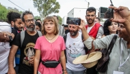 Swedish climate activist Greta Thunberg walks with a crowd of pro-Palestinian activists that arrived to greet the Global Sumud Flottila at the port of the village of Sidi Bou Said on September 7, 2025. Photo by Yassine Mahjoub / AFP