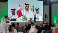 Reporters follow HH the Amir Sheikh Tamim bin Hamad Al-Thani's address at the media centre, during the opening of the 2025 Arab-Islamic emergency summit in Doha on September 15, 2025. Photo by Mahmud Hams / AFP