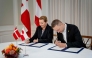 Denmark's Prime Minister Mette Frederiksen (L) and Greenland's government leader Jens Frederik Nielsen sign a framework agreement for a self-sustaining Greenland at the Prime Minister's Office in Copenhagen, Denmark, on September 16, 2025. (Photo by Mads Claus Rasmussen / Ritzau Scanpix / AFP) 