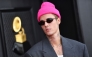 File: Canadian singer and songwriter Justin Bieber arrives for the 64th Annual Grammy Awards at the MGM Grand Garden Arena in Las Vegas, on April 3, 2022. (Photo by Angela Weiss / AFP)

