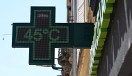 (Files) A pharmacy sign displays a temperature of 45 degrees Celsius in Thionville, north-eastern France, on July 2, 2025, as a heatwave hits Europe. (Photo by Jean-Christophe Verhaegen / AFP)

