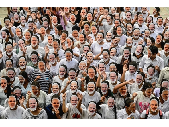 Students wear masks of India's Prime Minister Narendra Modi to celebrate his 75th birthday, in Chandigarh on September 17, 2025. (Photo by AFP)
