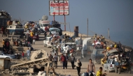 Displaced Palestinians move with their belongings southwards on a road in the Nuseirat refugee camp area in the central Gaza Strip following renewed Israeli evacuation orders for Gaza City on September 18, 2025. Photo by Eyad BABA / AFP