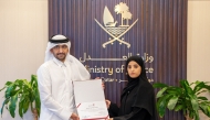 Minister of Justice and Minister of State for Cabinet Affairs H E Ibrahim bin Ali Al Mohannadi presenting a certificate at the event.
