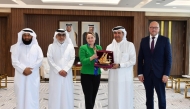 Non-Resident Ambassador of Latvia to Qatar, H E Dana Goldfinča with QC Board Member Abdulrahman bin Abduljalil Al Abdulghani, along with other officials.