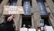 Demonstrators protest the suspension of the 