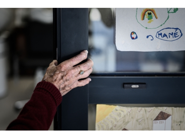 (Files) In this picture taken on September 9, 2020 an Alzheimer's patient stands at the entrance of the hairdressing salon in Dax, southwestern France. (Photo by Philippe Lopez/ AFP)