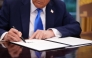 President Donald Trump signs an executive order in the Oval Office at the White House on September 19, 2025 in Washington, DC. Trump signed a series of executive orders establishing the “Trump Gold Card” and introducing a $100,000 fee for H-1B visas. (Photo by Andrew Harnik / GETTY IMAGES NORTH AMERICA / Getty Images via AFP)
