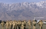 (Files) In this file photo taken on January 15, 2002, American soldiers approach the United Nations planes on the tarmac of the Bagram airbase in Bagram. (Photo by Jimin Lai / AFP)