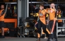 McLaren's Australian driver Oscar Piastri (L) walks in the pits after crashing during a qualifying session of the Formula One Azerbaijan Grand Prix at the Baku City Circuit in Baku on September 20, 2025. (Photo by Anton Vaganov / POOL / AFP)