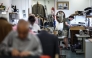 Apprentice tailor Charlie makes adjustments to a jacket at Henry Poole & Co on Savile Row in London on August 12, 2025. (Photo by Henry Nicholls / AFP)