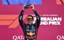 Red Bull Racing's Dutch driver Max Verstappen celebrates with his trophy on the podium after the Formula One Azerbaijan Grand Prix at the Baku City Circuit in Baku on September 21, 2025. (Photo by Alexander NEMENOV / AFP)