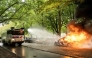 A police car is set on fire during the 