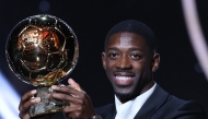 Paris Saint-Germain's French forward Ousmane Dembele reacts receiving the Ballon d'Or award during the 2025 Ballon d'Or France Football award ceremony at the Theatre du Chatelet in Paris on September 22, 2025. (Photo by Franck FIFE / AFP)
