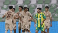 Al Rayyan players celebrate during the match against Al Wakrah yesterday.  