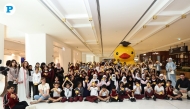 School students with officials during the ‘Duck Release’ event at the Place Vendôme Mall in Lusail yesterday. Pic: Salim Matramkot/THE PENINSULA