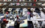 Workers operate sewing machines to stitch pieces of fabric together to make jeans inside the United Aryan textile factory at the Export Processing Zone (EPZ) in Nairobi on February 4, 2025. (Photo by Simon Maina / AFP)