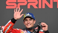Ducati Lenovo Team's Spanish MotoGP rider Marc Marquez celebrates on the podium after finishing in second place during the MotoGP sprint race. (Photo by Toshifumi Kitamura / AFP)