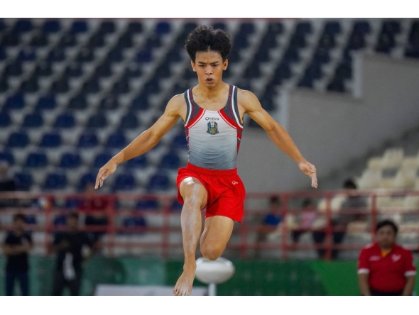 This picture taken on August 30, 2024 shows Indonesian gymnast Naufal Takdir Al Bari representing East Java competing at the 21st National Sports Week in Deli Serdang, North Sumatra. (Photo by Hendra Syamhari / AFP)