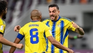 Al Gharafa's Yacine Brahimi (left) and Joselu celebrate after the latter scored their team's opening goal.