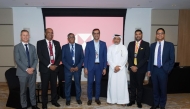 HSBC Qatar officials pose for a group photo during the event.