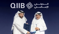 NCSA President Eng. Abdul Rahman Ali Muhammad Al-Farahid Al-Malki presenting the NIA certification to QIIB Chief Executive Officer, Dr. Abdulbasit Ahmad al-Shaibei.