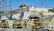 Security personnel inspect an explosion site outside the Frontier Corps (FC) headquarters in Quetta on September 30, 2025. (Photo by Banaras KHAN / AFP)
