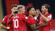 Al Rayyan's Roger Guedes (centre) celebrates with teammates.
