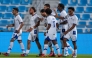 Al Kharaitiyat players celebrate a goal against Al Duhail.