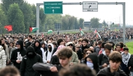 Pro-Palestinian demonstrators march during the protest on the Milan's highway against the interception of the Global Sumud Flotilla, on October 3, 2025. (Photo by Stefano RELLANDINI / AFP)